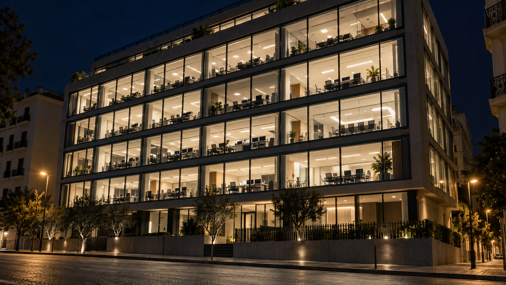 Oficinas iluminadas durante la noche · Imagen ilustrativa